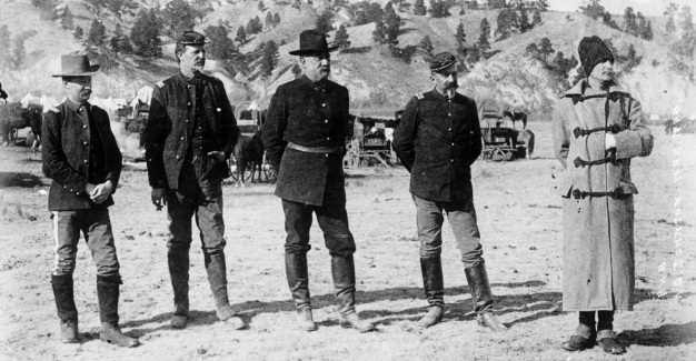 Brigadier General John R. Brooke and staff at Pine Ridge, published January 1891 by A. G. Johnson, York, Ne-braska. Left to right 1st Lt. C. M. Truitt, 21st Infantry, Aide-de-camp; Maj. D. W. Benham, 7th Infantry, Inspector of rifle practice; Gen. Brooke, Commander, Department of the Platte; Maj. J. M. Bacon, 7th Cavalry, Inspector General; 1st Lt. F. W. Roe, 3rd Infantry, Aide-de-camp. Photograph is from the Denver Public Library Western History Collection, Call number x-31491.